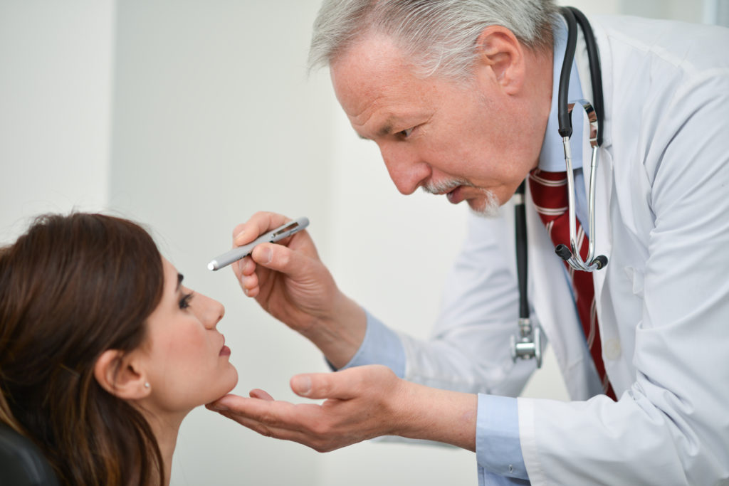 Doctor visiting a patient's eyes