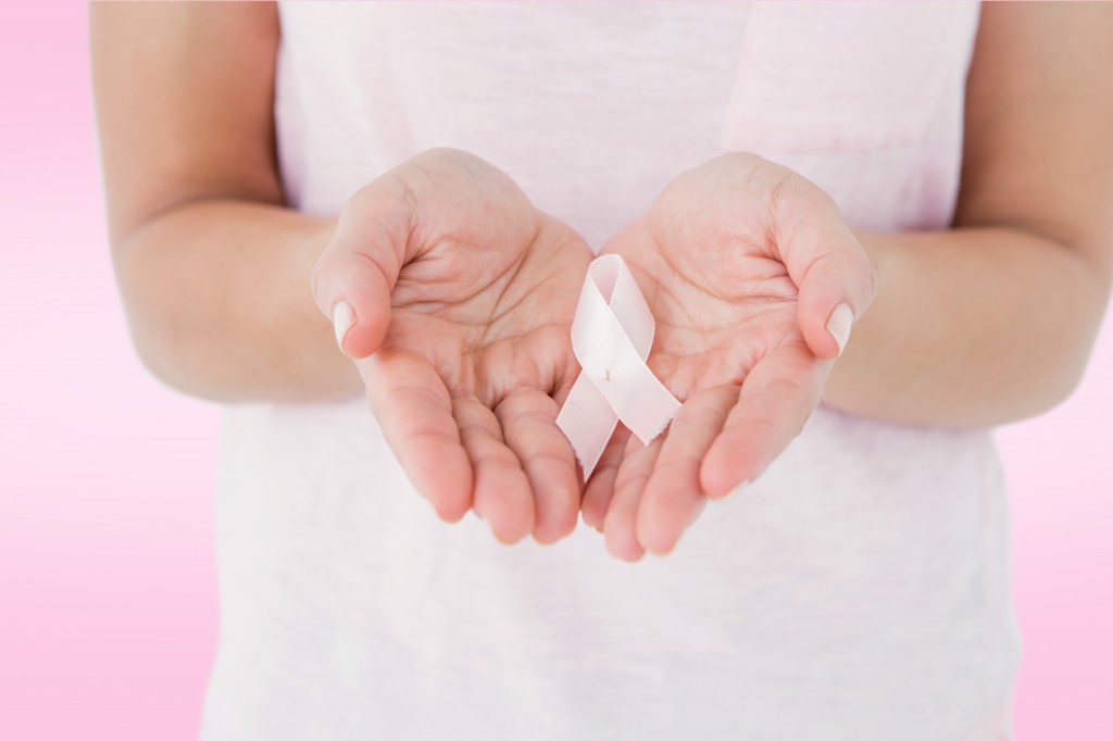 Woman holding pink ribbon